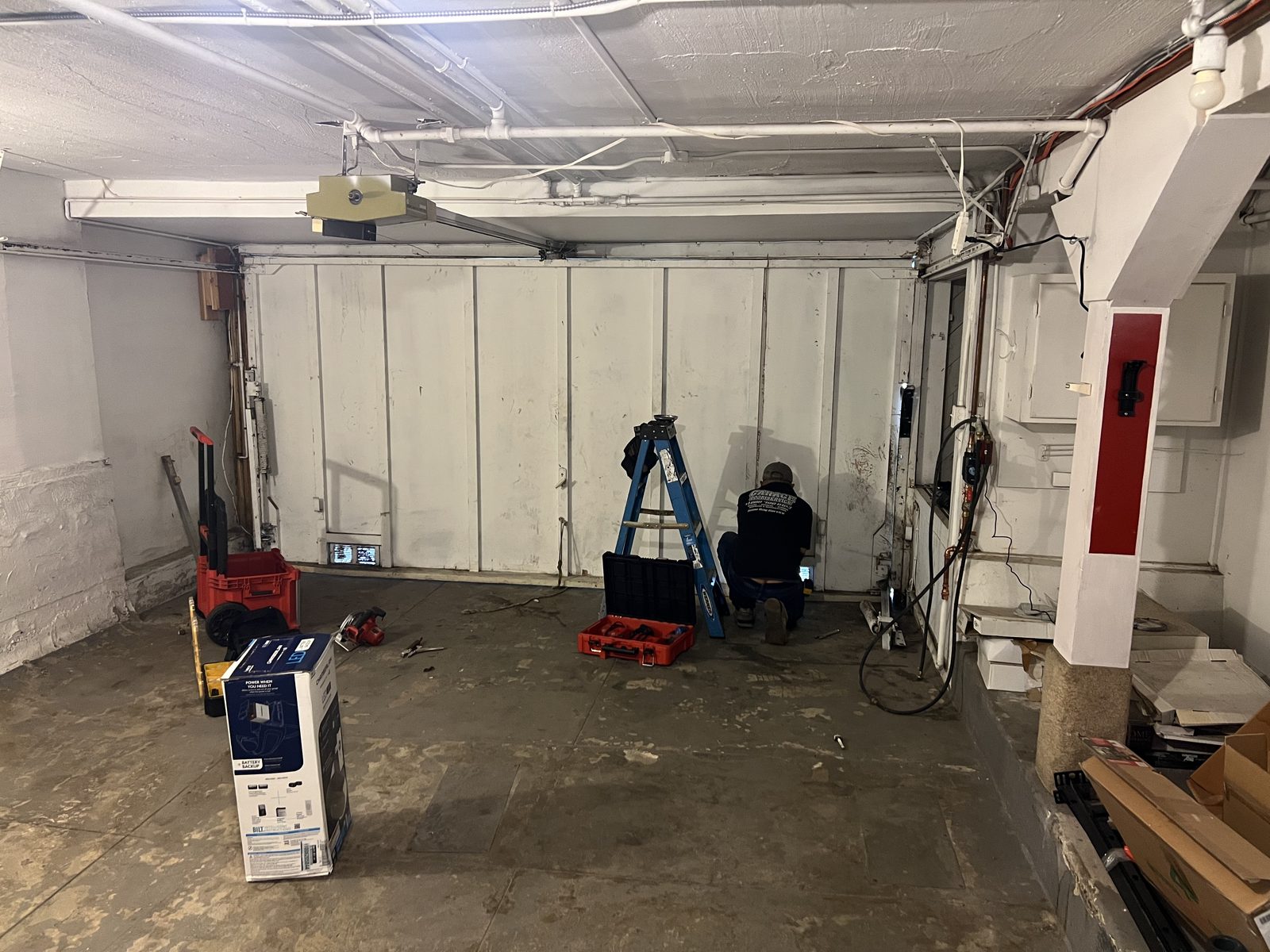 Coastside Garage Door technician repairing a garage door in Pacifica